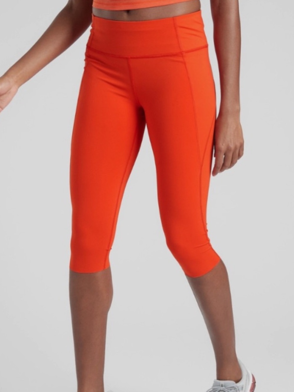 Athleta Velocity Stash Pocket Crop Legging (color: bolero orange)